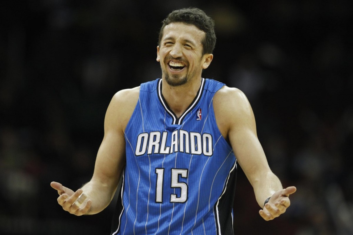 Orlando Magic's Hedo Turkoglu, who scored 20 points in his team's points in a  104-88 win over the New Jersey Nets, smiles during the third quarter of an NBA basketball game, Monday, Dec. 27, 2010, in Newark, N.J. (AP Photo/Julio Cortez)