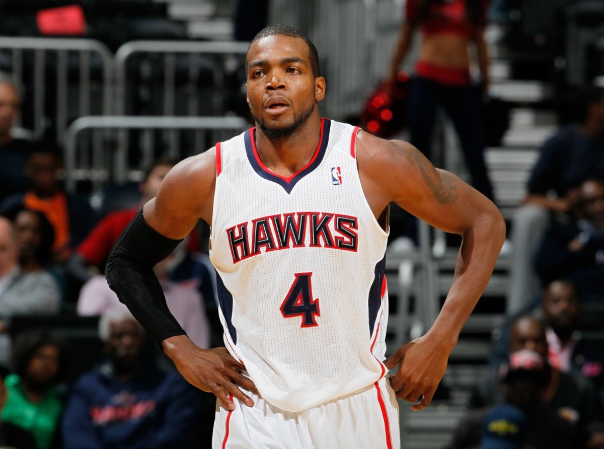 ATLANTA, GA - DECEMBER 18:  Paul Millsap #4 of the Atlanta Hawks against the Sacramento Kings at Philips Arena on December 18, 2013 in Atlanta, Georgia.  NOTE TO USER: User expressly acknowledges and agrees that, by downloading and or using this photograph, User is consenting to the terms and conditions of the Getty Images License Agreement  (Photo by Kevin C. Cox/Getty Images)
