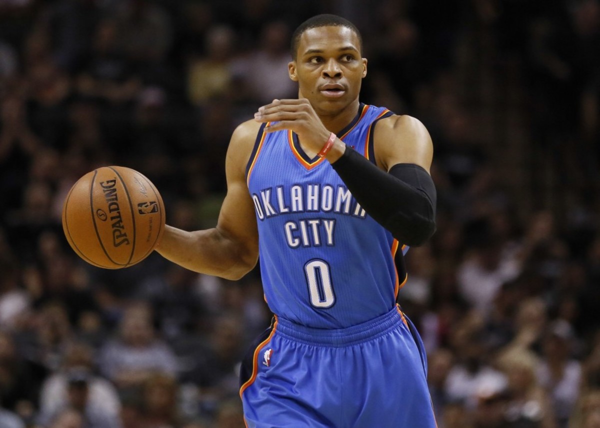 May 29, 2014; San Antonio, TX, USA; Oklahoma City Thunder guard Russell Westbrook (0) dribbles during the first quarter against the San Antonio Spurs in game five of the Western Conference Finals of the 2014 NBA Playoffs at AT&amp;T Center. Mandatory Credit: Soobum Im-USA TODAY Sports
