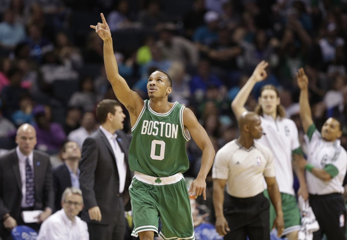 Boston Celtics' Avery Bradley (0) celebrates after making a three point basket against the Charlotte Hornets during the second half of an NBA basketball game in Charlotte, N.C., Monday, March 30, 2015. The Celtics won 116-104. (AP Photo/Chuck Burton)