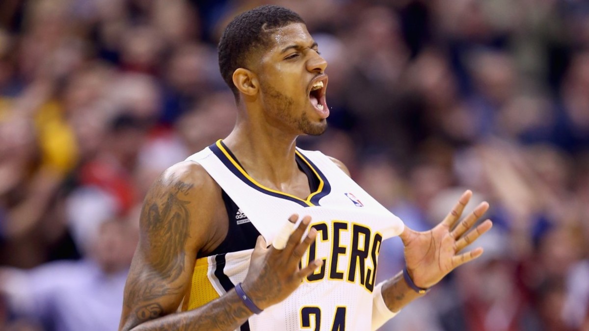 INDIANAPOLIS, IN - FEBRUARY 07:  Paul George#24 of the Indiana Pacers  celebrates during overtime in the118-113 win over the Portland Trailblazers  at Bankers Life Fieldhouse on February 7, 2014 in Indianapolis, Indiana.  NOTE TO USER: User expressly acknowledges and agrees that, by downloading and or using this Photograph, user is consenting to the terms and condition of the Getty Images License Agreement.  (Photo by Andy Lyons/Getty Images)