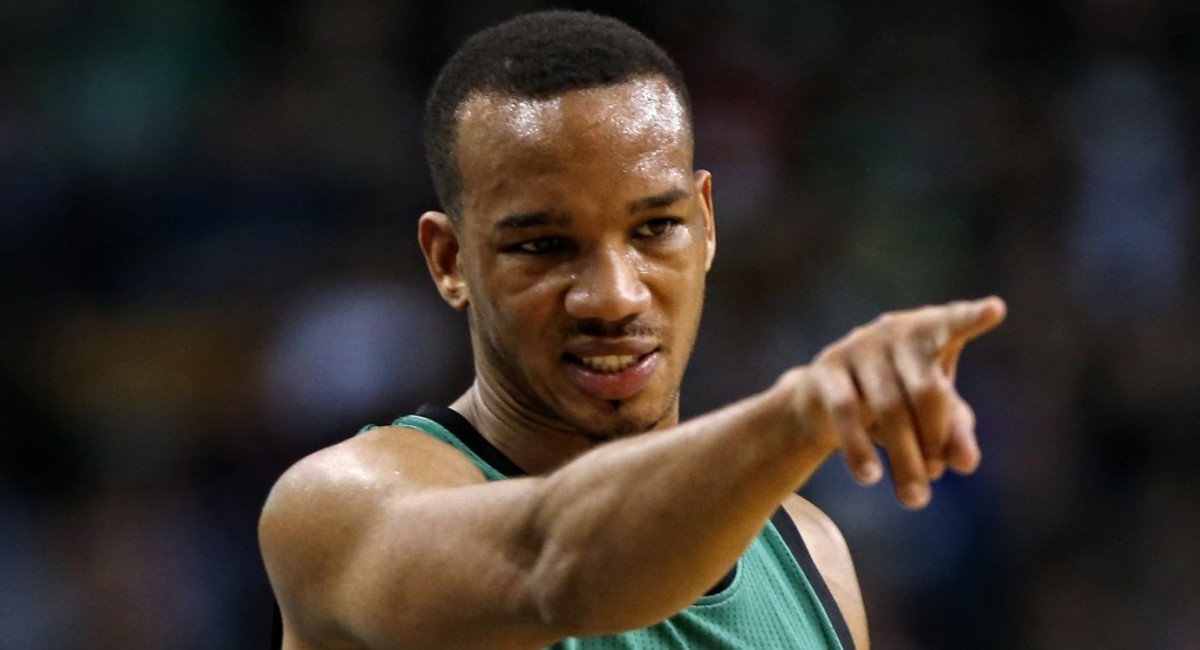 Boston Celtics' Avery Bradley points to a teammate during the first quarter of an NBA basketball game against the Washington Wizards in Boston, Friday, Nov. 27, 2015. (AP Photo/Winslow Townson)