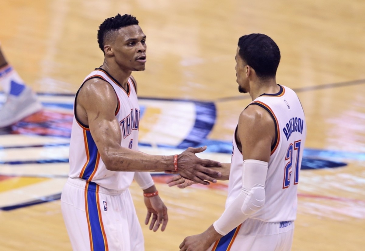 May 24, 2016; Oklahoma City, OK, USA; Oklahoma City Thunder guard Russell Westbrook (0) celebrates with  guard Andre Roberson (21) during the fourth quarter against the Golden State Warriors in game four of the Western conference finals of the NBA Playoffs at Chesapeake Energy Arena. Mandatory Credit: Kevin Jairaj-USA TODAY Sports