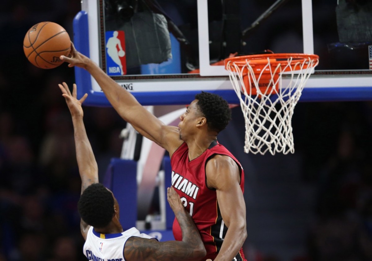 Nov 25, 2015; Auburn Hills, MI, USA; Miami Heat center Hassan Whiteside (21) blocks the shot of Detroit Pistons guard Kentavious Caldwell-Pope (5) during the second quarter of the game at The Palace of Auburn Hills. The Pistons defeated the Heat 104-01. Mandatory Credit: Leon Halip-USA TODAY Sports