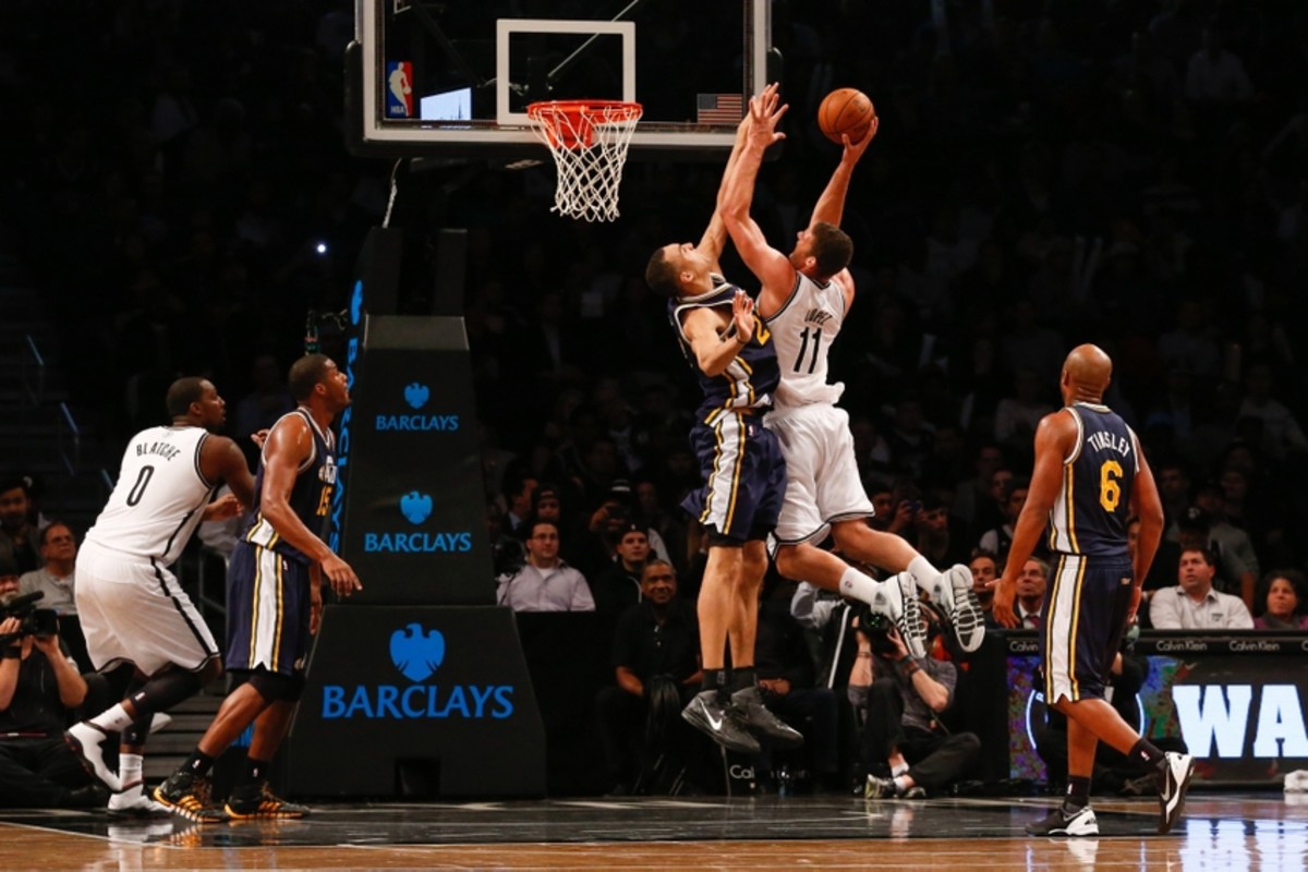 Nov 5, 2013; Brooklyn, NY, USA;  Brooklyn Nets center Brook Lopez (11) shoots over Utah Jazz center Rudy Gobert (27) during the third quarter at Barclays Center. Nets won 104-88.  Mandatory Credit: Anthony Gruppuso-USA TODAY Sports