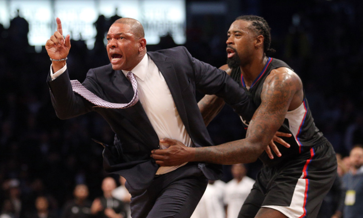 Nov 29, 2016; Brooklyn, NY, USA; Los Angeles Clippers head coach Doc Rivers is restrained by Los Angeles Clippers center DeAndre Jordan (6) as he argues with referee Ken Mauer (not pictured) after receiving a technical foul during the first overtime quarter against the Brooklyn Nets at Barclays Center. Rivers then received a second technical foul and was ejected from the game. Mandatory Credit: Brad Penner-USA TODAY Sports ORG XMIT: USATSI-323878 ORIG FILE ID:  20161129_kkt_ae5_194.jpg
