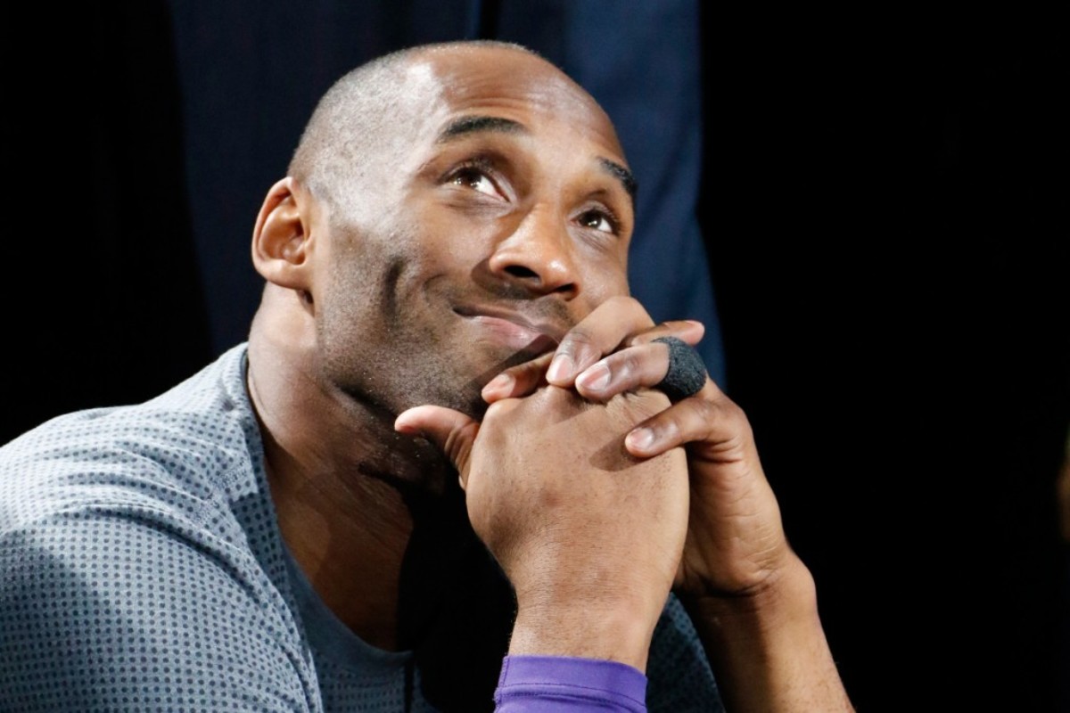 web-kobe-bryant-smiling-hands-clasped-ronald-cortes-getty-images