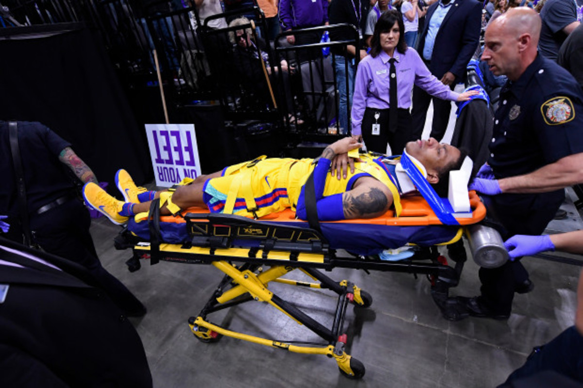 Golden State Warriors' Patrick McCaw (0) is transported by paramedics after sustaining an injury against the Sacramento Kings during the third quarter of their NBA game at the Golden 1 Center in Sacramento, Calif., on Saturday, March 31, 2018. (Jose Carlos Fajardo/Bay Area News Group)