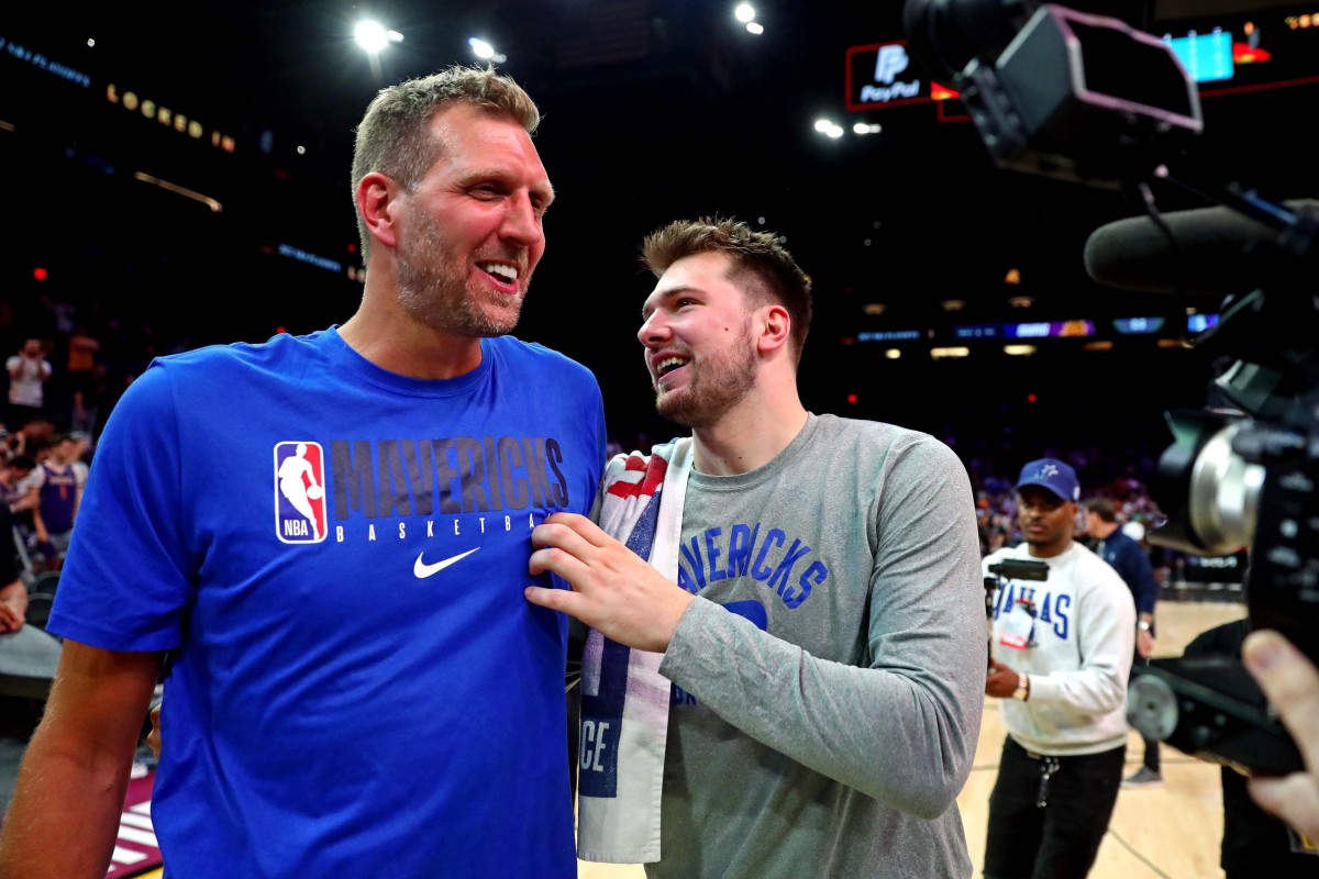 NBA great Dirk Nowitzki is honored for being selected to the NBA 75th Anniversary Team during halftime in the 2022 NBA All-Star Game at Rocket Mortgage FieldHouse.