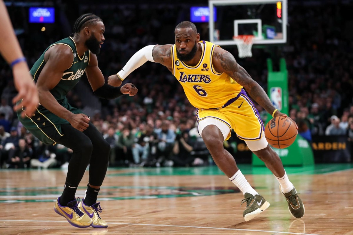 Boston, Massachusetts, USA; Los Angeles Lakers forward LeBron James (6) drives to the basket defended by Boston Celtics forward Jaylen Brown (7) during the second half at TD Garden. Mandatory Credit: Paul Rutherford-Imagn Images