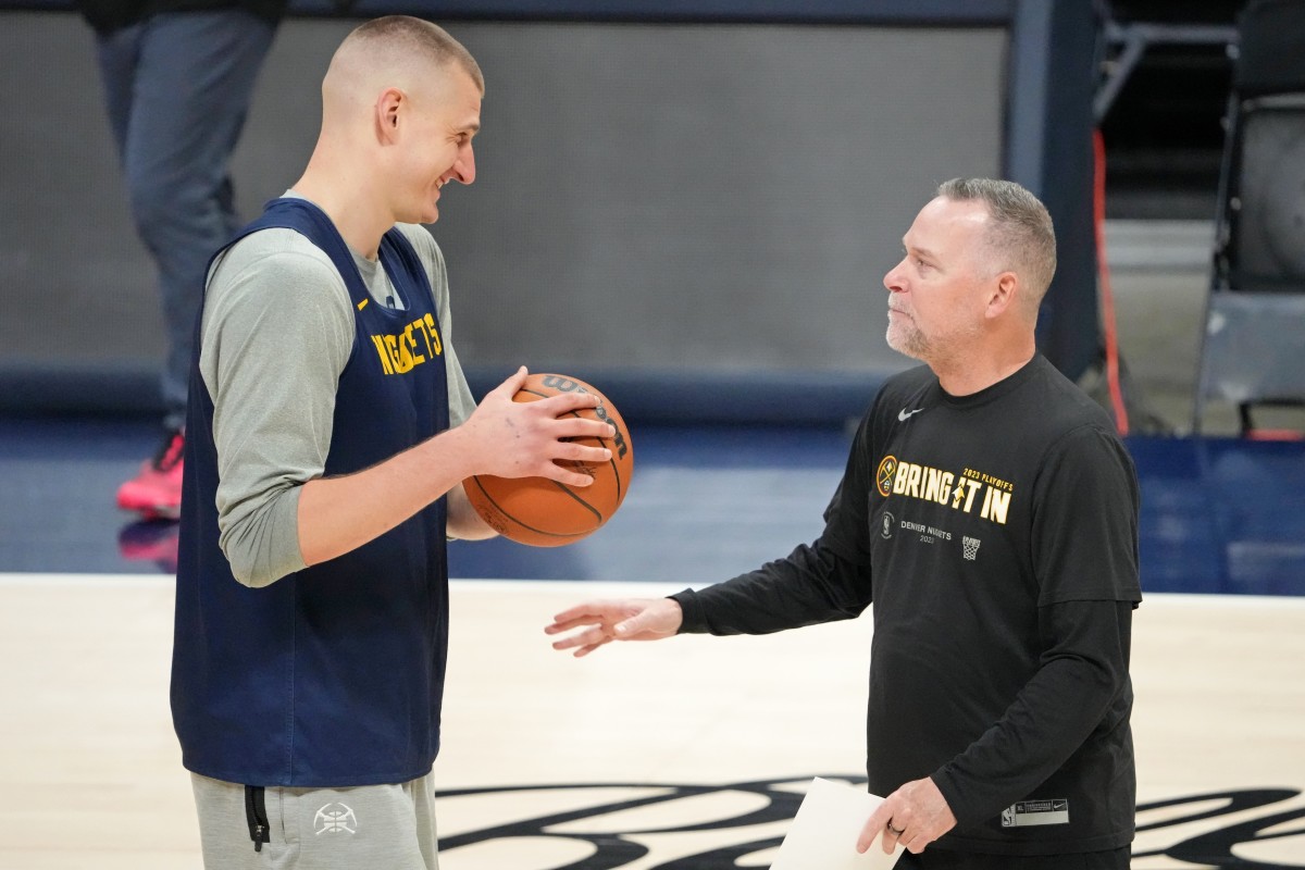  Denver Nuggets center Nikola Jokic (15) talks with head coach Michael Malone during a practice session on media day before the 2023 NBA Finals at Ball Arena. Mandatory Credit: Kyle Terada-Imagn Images
