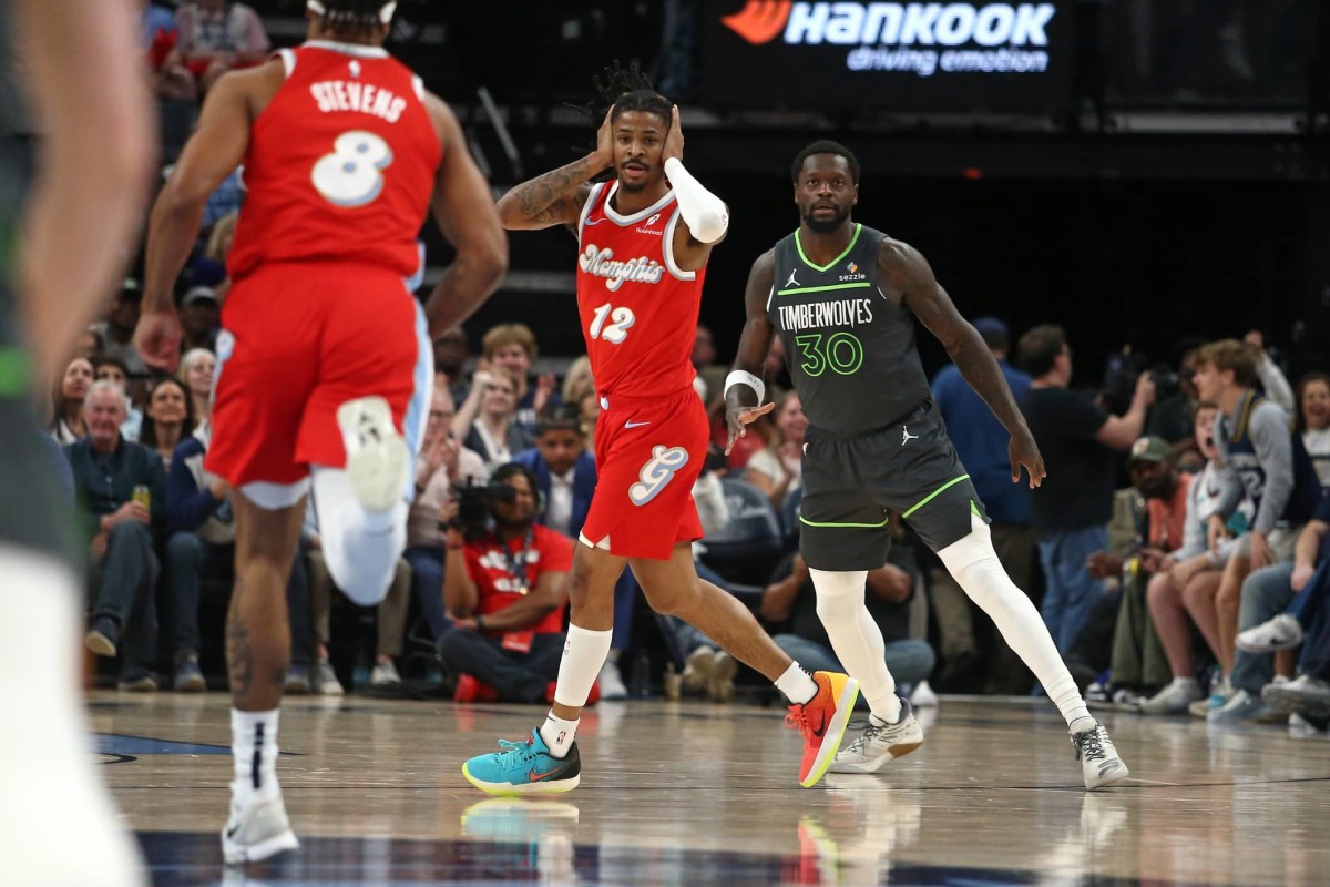 Memphis Grizzlies guard Ja Morant (12) reacts after a three-point basket during the first quarter against the Minnesota Timberwolves at FedExForum. Mandatory Credit: Petre Thomas-Imagn Images