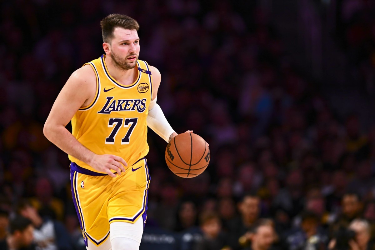 Apr 11, 2025; Los Angeles, California, USA; Los Angeles Lakers guard Luka Doncic (77) moves the ball against the Houston Rockets during the first half at Crypto.com Arena. Mandatory Credit: Jonathan Hui-Imagn Images