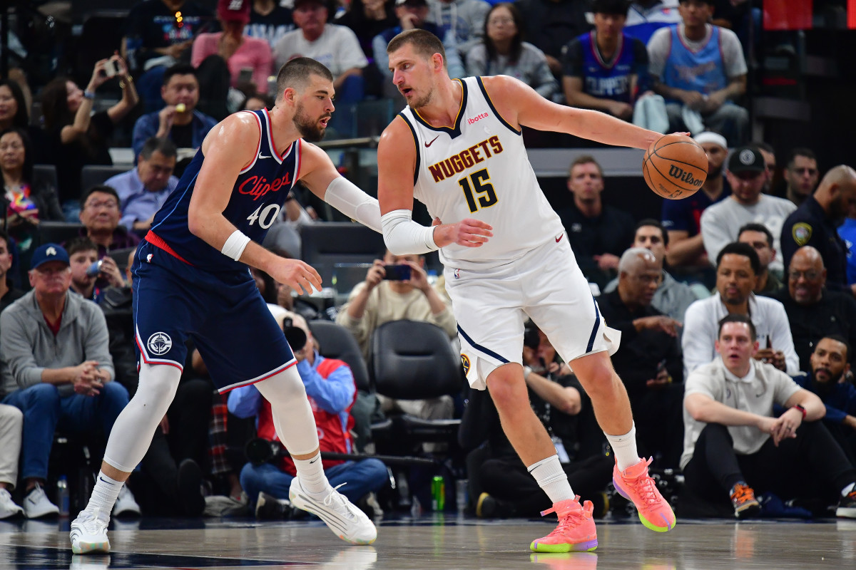 Apr 24, 2025; Inglewood, California, USA; Denver Nuggets center Nikola Jokic (15) controls the ball against Los Angeles Clippers center Ivica Zubac (40) during the second half of game three in the first round for the 2024 NBA Playoffs at Intuit Dome. Mandatory Credit: Gary A. Vasquez-Imagn Images  