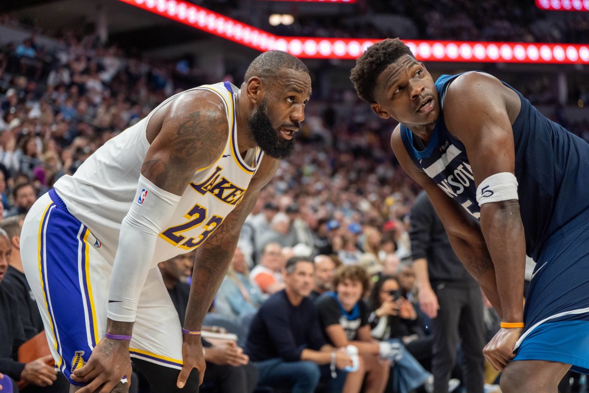 Apr 27, 2025; Minneapolis, Minnesota, USA; Minnesota Timberwolves guard Anthony Edwards (5) guards Los Angeles Lakers forward LeBron James (23) in the second quarter during game four of first round for the 2025 NBA Playoffs at Target Center. Mandatory Credit: Matt Blewett-Imagn Images