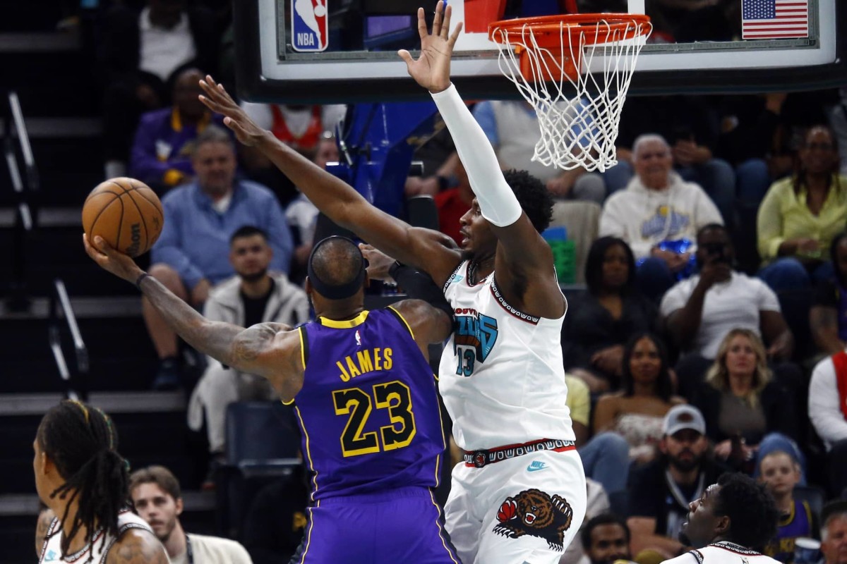 Mar 29, 2025; Memphis, Tennessee, USA; Memphis Grizzlies forward Jaren Jackson Jr. (13) defends as Los Angeles Lakers forward LeBron James (23) shoots during the third quarter at FedExForum. Mandatory Credit: Petre Thomas-Imagn Images