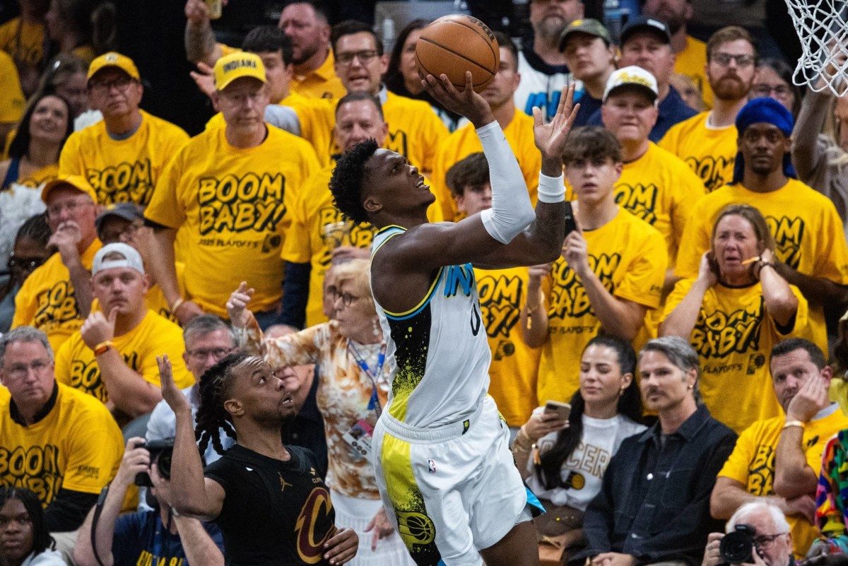 May 9, 2025; Indianapolis, Indiana, USA; Indiana Pacers guard Bennedict Mathurin (00) shoots the ball while Cleveland Cavaliers guard Darius Garland (10) defends during game three of the second round for the 2025 NBA Playoffs at Gainbridge Fieldhouse. Mandatory Credit: Trevor Ruszkowski-Imagn Images