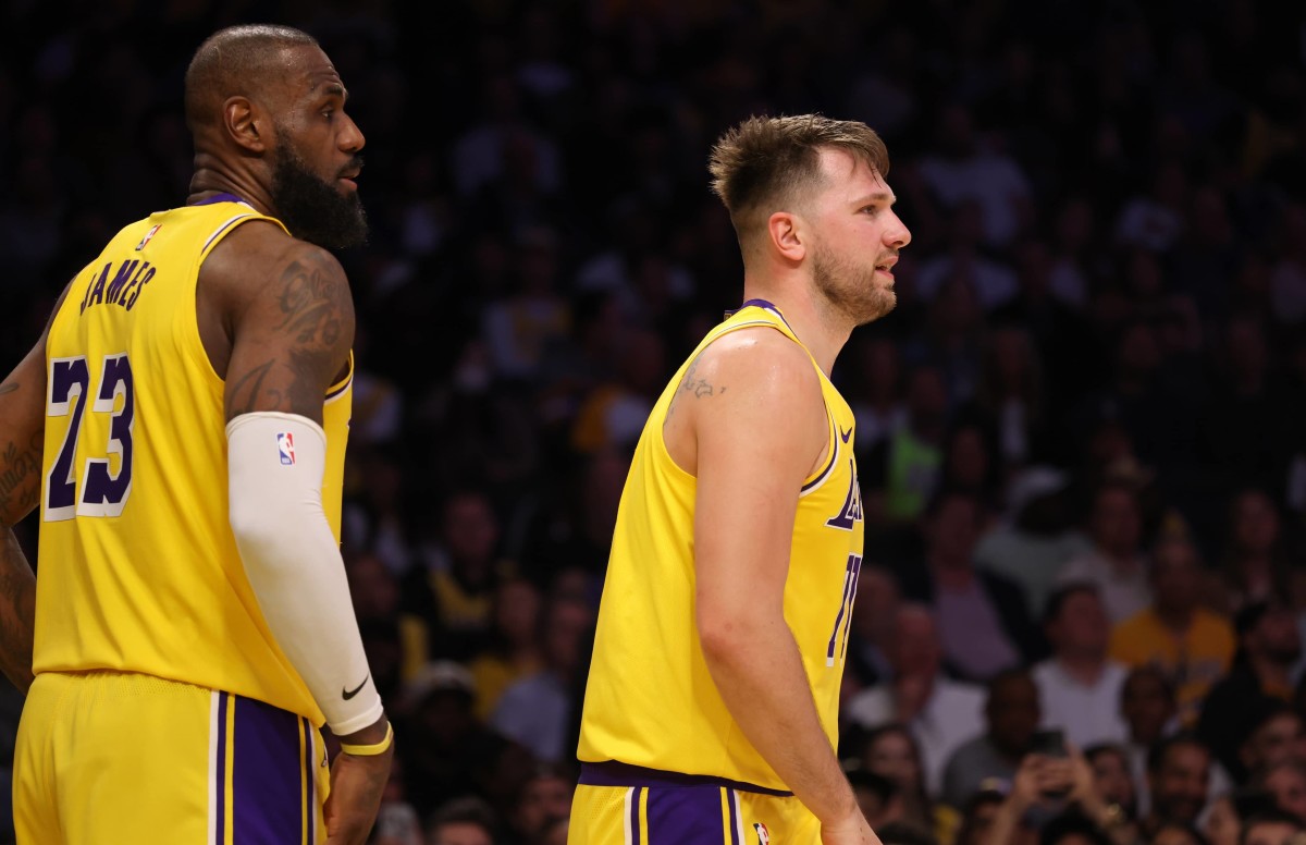 Feb 27, 2025; Los Angeles, California, USA; Los Angeles Lakers guard Luka Doncic (77) and forward LeBron James (23) during the fourth quarter against the Minnesota Timberwolves at Crypto.com Arena. Mandatory Credit: Jason Parkhurst-Imagn Images