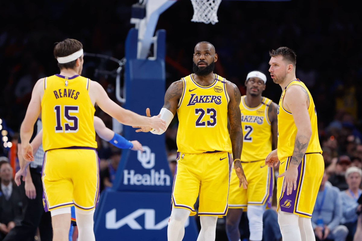 Apr 8, 2025; Oklahoma City, Oklahoma, USA; Los Angeles Lakers forward LeBron James (23) and guard Austin Reaves (15) high five after a play against the Oklahoma City Thunder during the second half at Paycom Center. Mandatory Credit: Alonzo Adams-Imagn Images