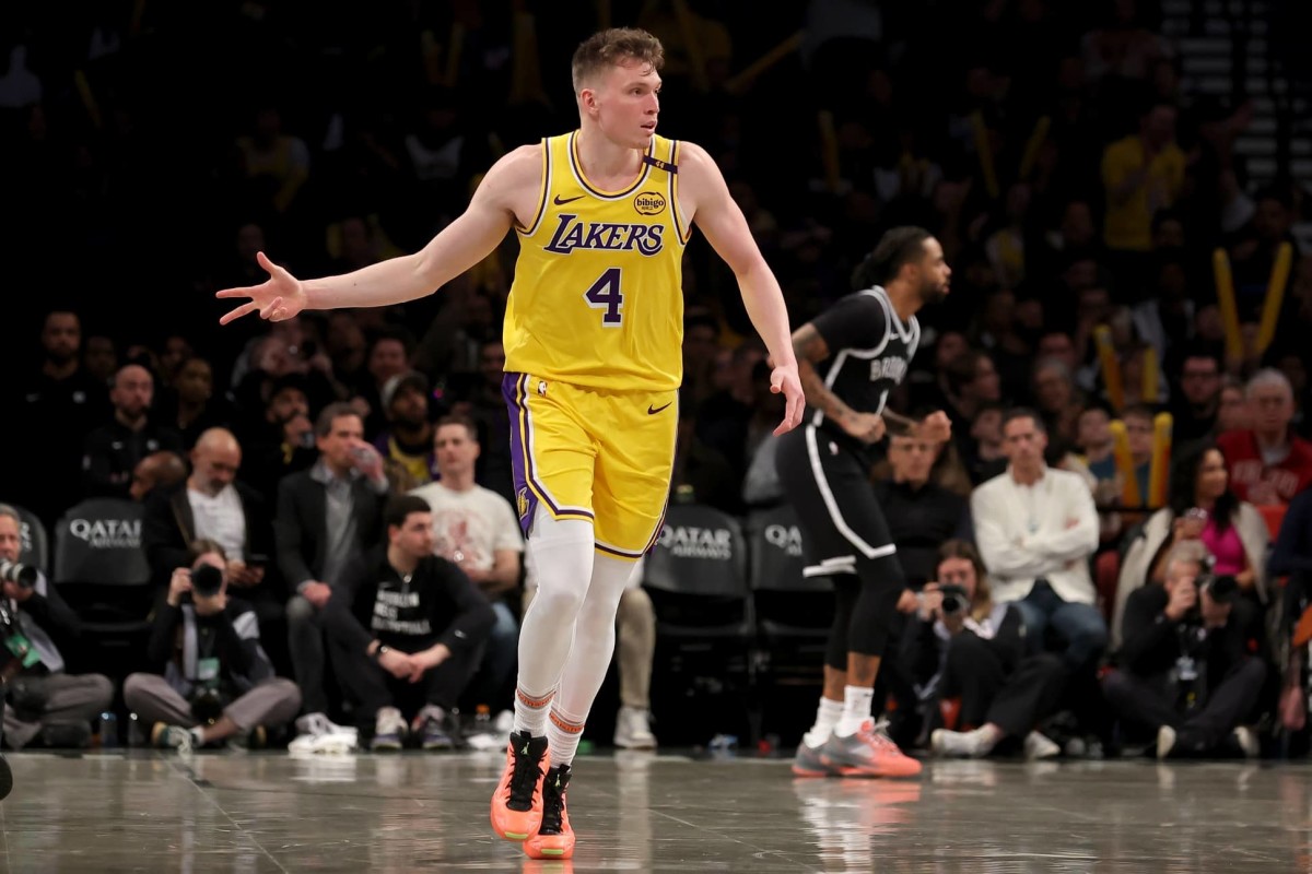 Brooklyn, New York, USA; Los Angeles Lakers guard Dalton Knecht (4) celebrates his three point shot against the Brooklyn Nets during the third quarter at Barclays Center. Mandatory Credit: Brad Penner-Imagn Images