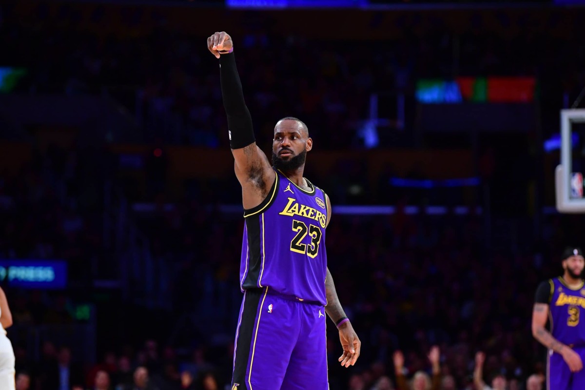 Los Angeles, California, USA; Los Angeles Lakers forward LeBron James (23) reacts after scoring three point basket against the Atlanta Hawks during the second half at Crypto.com Arena. Mandatory Credit: Gary A. Vasquez-Imagn Images