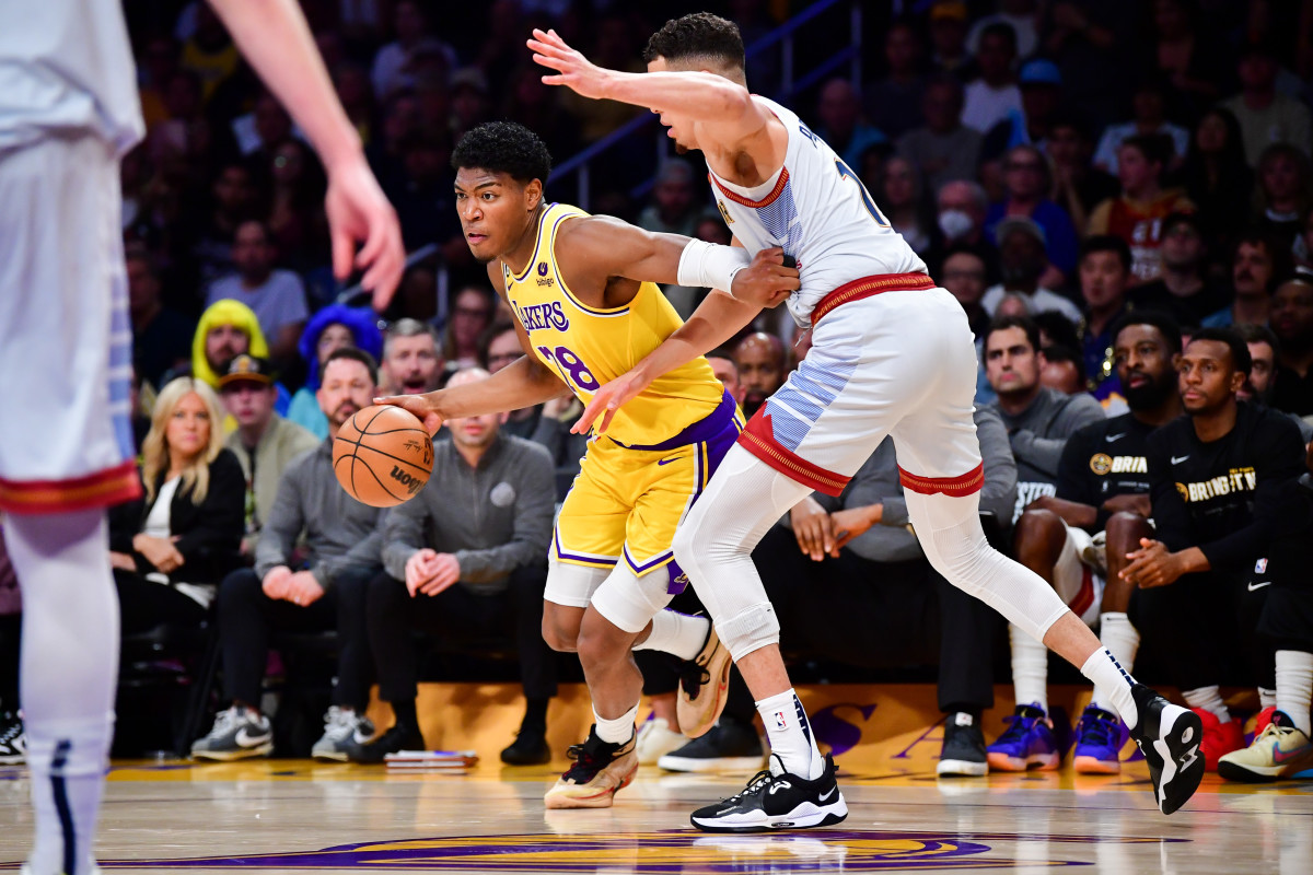 Los Angeles, California, USA; Los Angeles Lakers forward Rui Hachimura (28) drives to the basket against Denver Nuggets forward Michael Porter Jr. (1) at Crypto.com Arena. Mandatory Credit: Gary A. Vasquez-Imagn Images