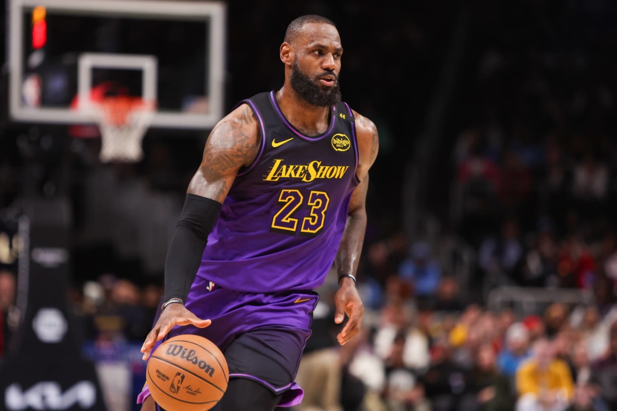 Atlanta, Georgia, USA; Los Angeles Lakers forward LeBron James (23) dribbles against the Atlanta Hawks in the second quarter at State Farm Arena. Mandatory Credit: Brett Davis-Imagn Images