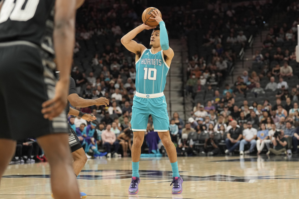 Mar 14, 2025; San Antonio, Texas, USA; Charlotte Hornets guard Josh Green (10) shoots during the first half against the San Antonio Spurs at Frost Bank Center. Mandatory Credit: Scott Wachter-Imagn Images 