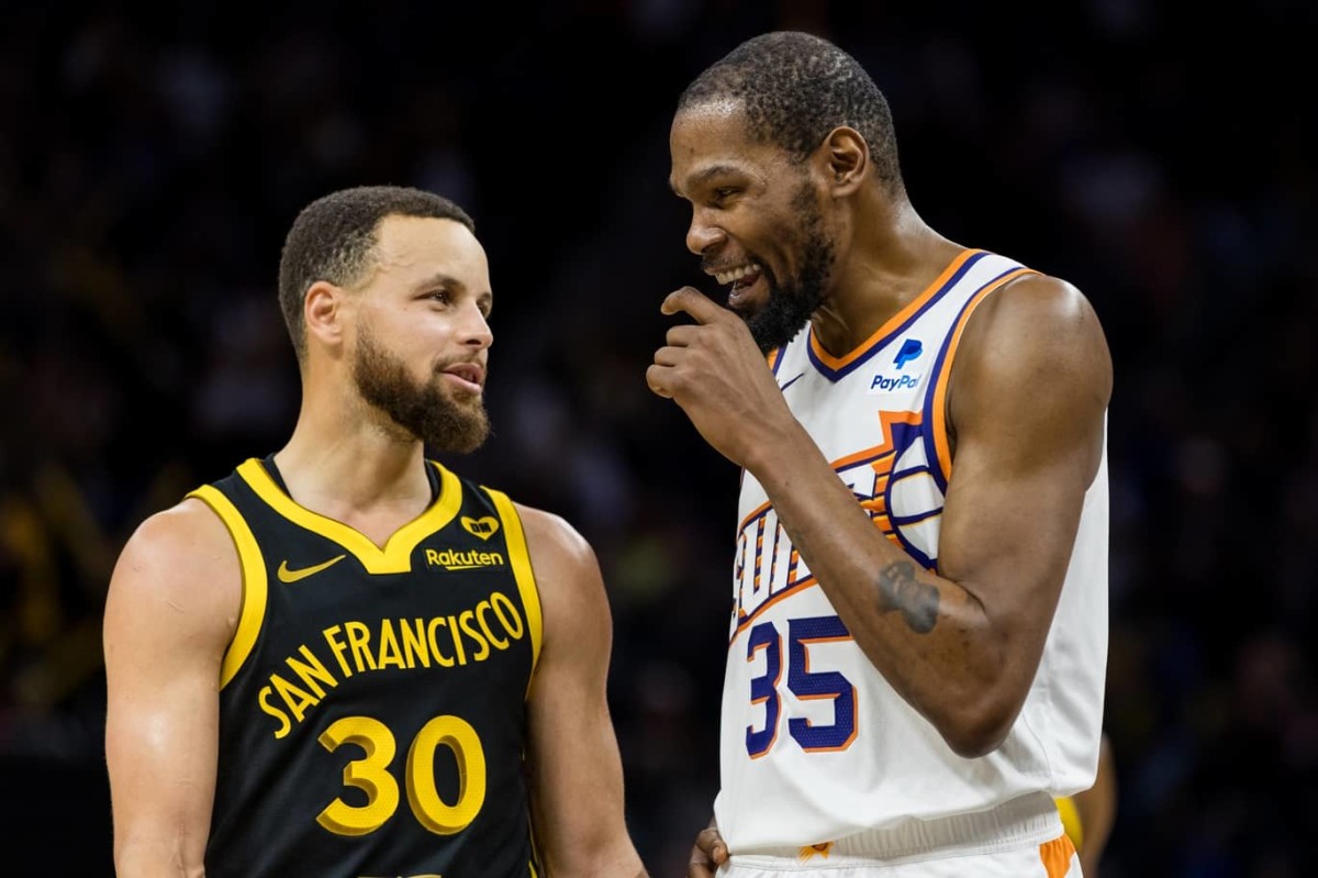 Feb 10, 2024; San Francisco, California, USA; Golden State Warriors guard Stephen Curry (30) and Phoenix Suns forward Kevin Durant (35) talk during the second half at Chase Center.