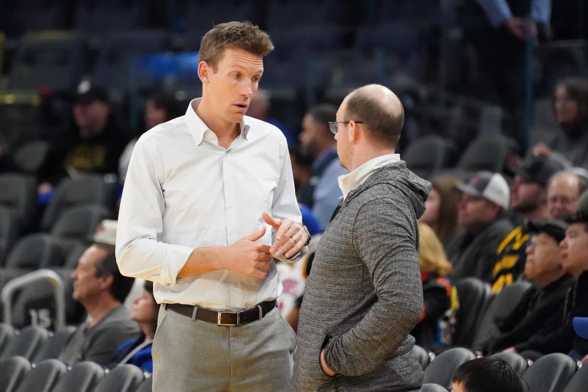 Golden State Warriors general manager Mike Dunleavy chats before the game against the Memphis Grizzlies at Chase Center.