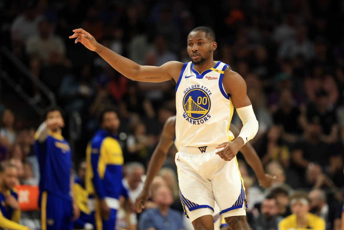 Apr 8, 2025; Phoenix, Arizona, USA; Golden State Warriors forward Jonathan Kuminga (00) against the Phoenix Suns at Footprint Center. Mandatory Credit: Mark J. Rebilas-Imagn Images