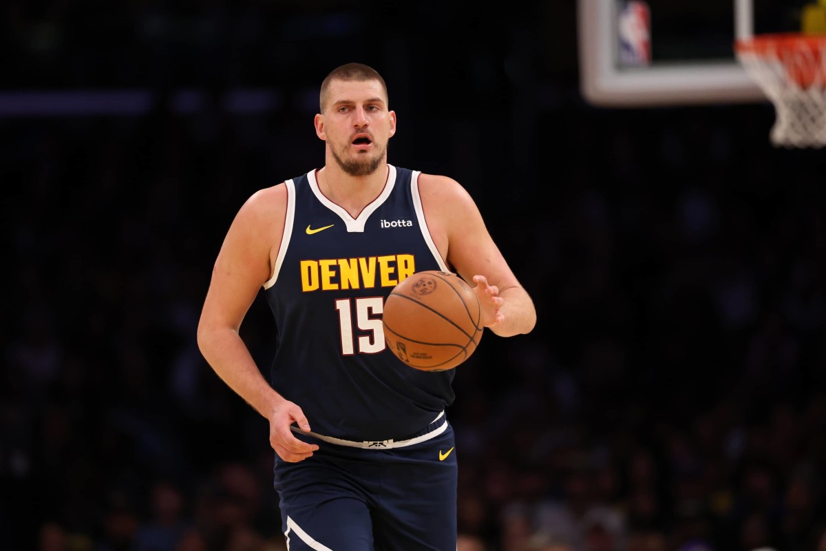 Los Angeles, California, USA; Denver Nuggets center Nikola Jokic (15) dribbles the ball during the first quarter against the Los Angeles Lakers at Crypto.com Arena. Mandatory Credit: Kiyoshi Mio-Imagn Images