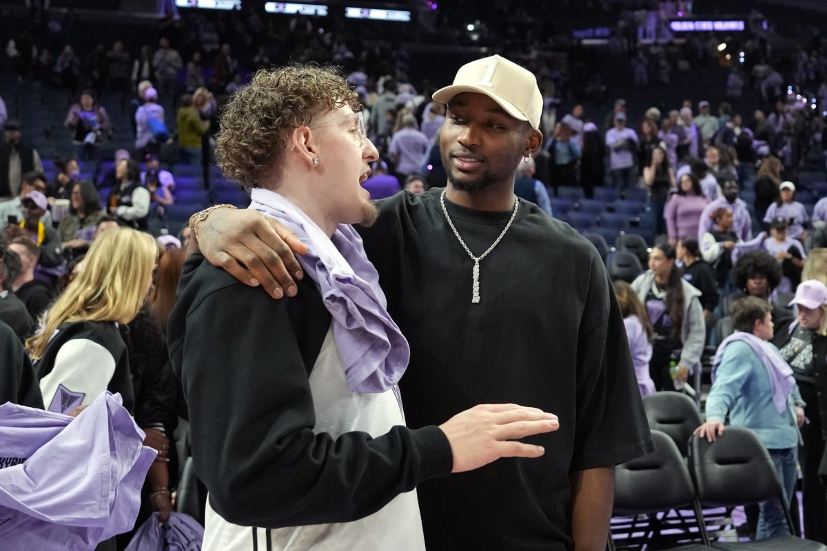 May 16, 2025; San Francisco, California, USA; Golden State Warriors guard Brandin Podziemski (left) and Jonathan Kuminga (right) talk after the game between the Golden State Valkyries and the Los Angeles Sparks at Chase Center.