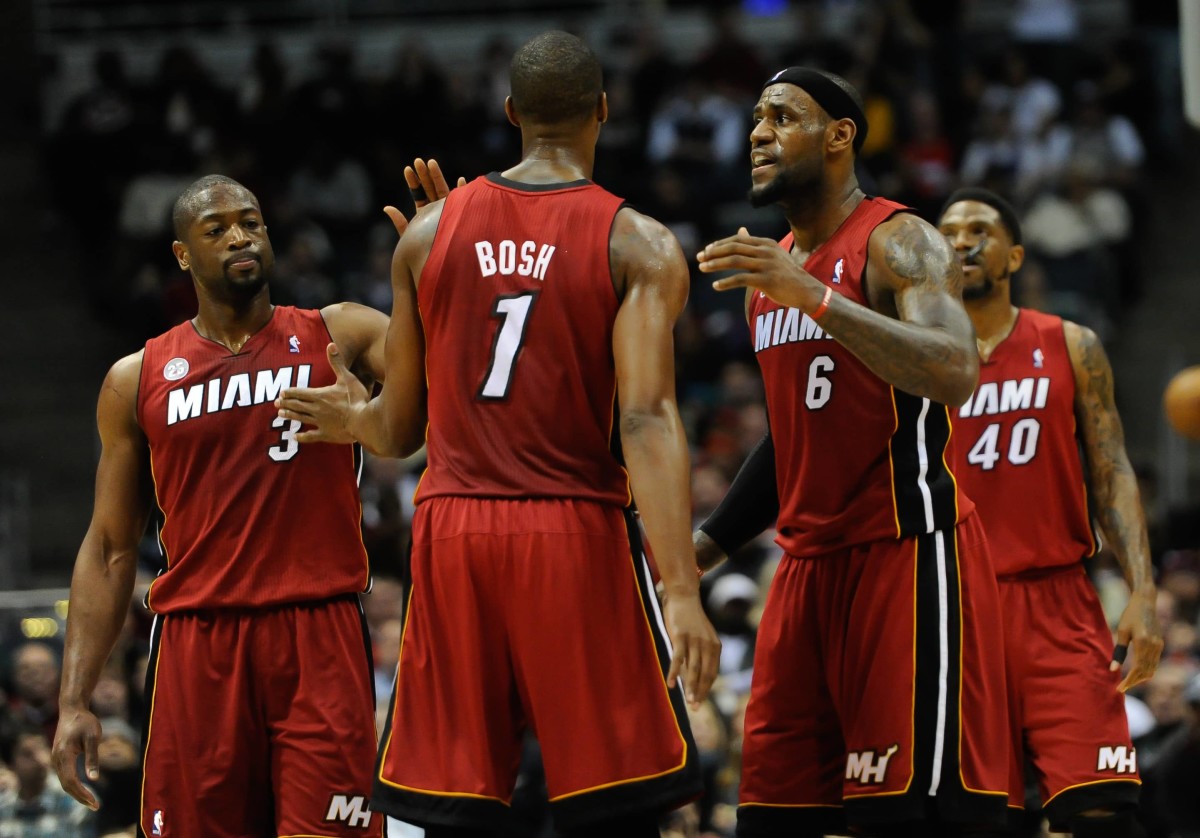 Milwaukee, WI, USA; Miami Heat forward LeBron James (6) reacts with center Chris Bosh (1) and guard Dwyane Wade (3) after a Heat basket during the game against the Milwaukee Bucks at the Bradley Center.
