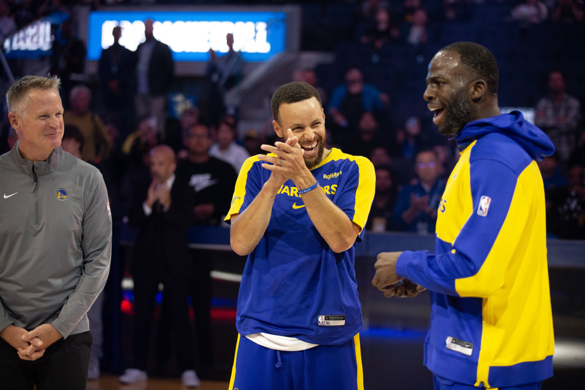 Oct 11, 2024; San Francisco, California, USA; Golden State Warriors head coach Steve Kerr, from left, guard Stephen Curry and forward Draymond Green share a laugh before taking on the Sacramento Kings at Chase Center. Mandatory Credit: D. Ross Cameron-Imagn Images  