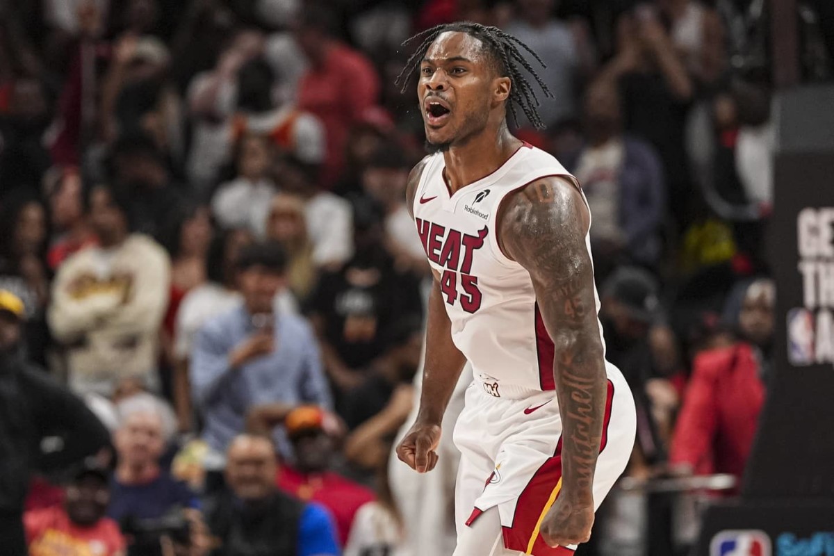 Apr 18, 2025; Atlanta, Georgia, USA; Miami Heat guard Davion Mitchell (45) reacts after the Heat defeat the Atlanta Hawks in overtime at State Farm Arena. Mandatory Credit: Dale Zanine-Imagn Images