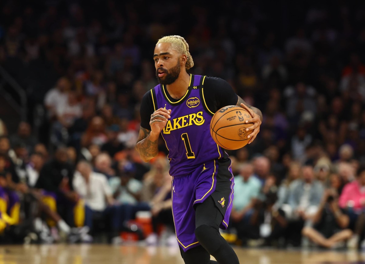 Oct 28, 2024; Phoenix, Arizona, USA; Los Angeles Lakers guard D'Angelo Russell (1) against the Phoenix Suns at Footprint Center. Mandatory Credit: Mark J. Rebilas-Imagn Images