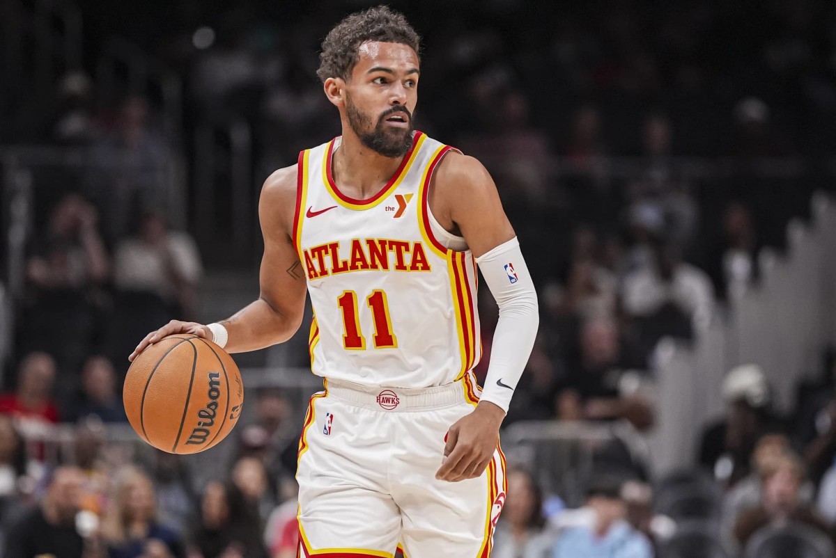 Oct 8, 2024; Atlanta, Georgia, USA; Atlanta Hawks guard Trae Young (11) controls the ball against the Indiana Pacers during the first half at State Farm Arena.