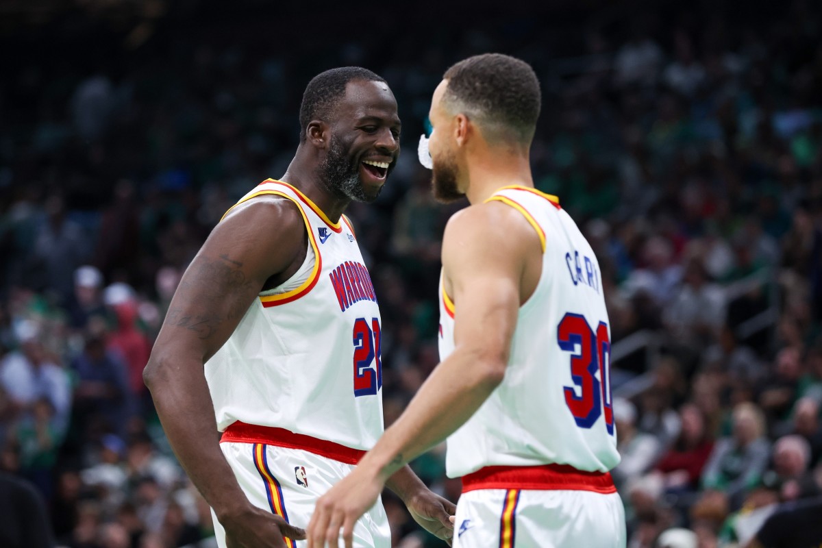 Nov 6, 2024; Boston, Massachusetts, USA; Golden State Warriors forward Draymond Green (23) and Golden State Warriors guard Stephen Curry (30) celebrate during the first half against the Boston Celtics at TD Garden.