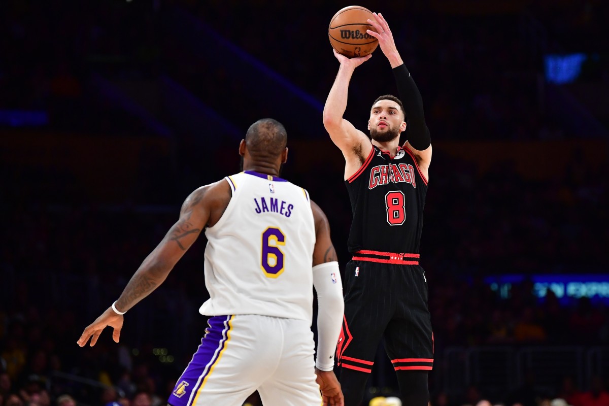 Mar 26, 2023; Los Angeles, California, USA; Chicago Bulls guard Zach LaVine (8) shoots against Los Angeles Lakers forward LeBron James (6) during the second half at Crypto.com Arena.