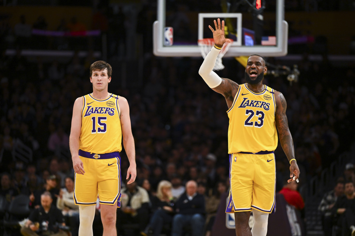 Nov 8, 2024; Los Angeles, California, USA; Los Angeles Lakers guard Austin Reaves (15) and forward LeBron James (23) on the court against the Philadelphia 76ers during the second half at Crypto.com Arena.