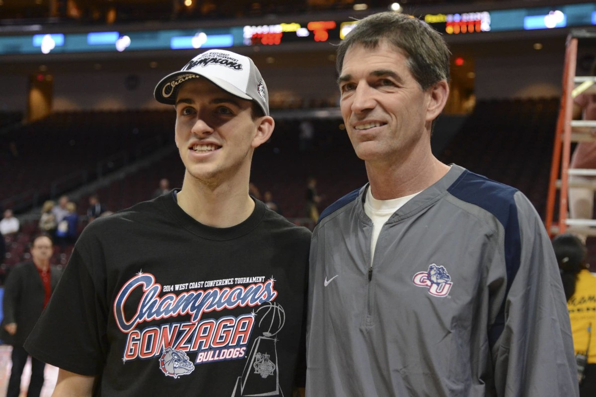 March 11, 2014; Las Vegas, NV, USA; Gonzaga Bulldogs guard David Stockton (11, left) poses for a photo with father John Stockton (right) against the Brigham Young Cougars after the game in the championship game of the West Coast Conference tournament at Orleans Arena. Mandatory Credit: Kyle Terada-Imagn Images