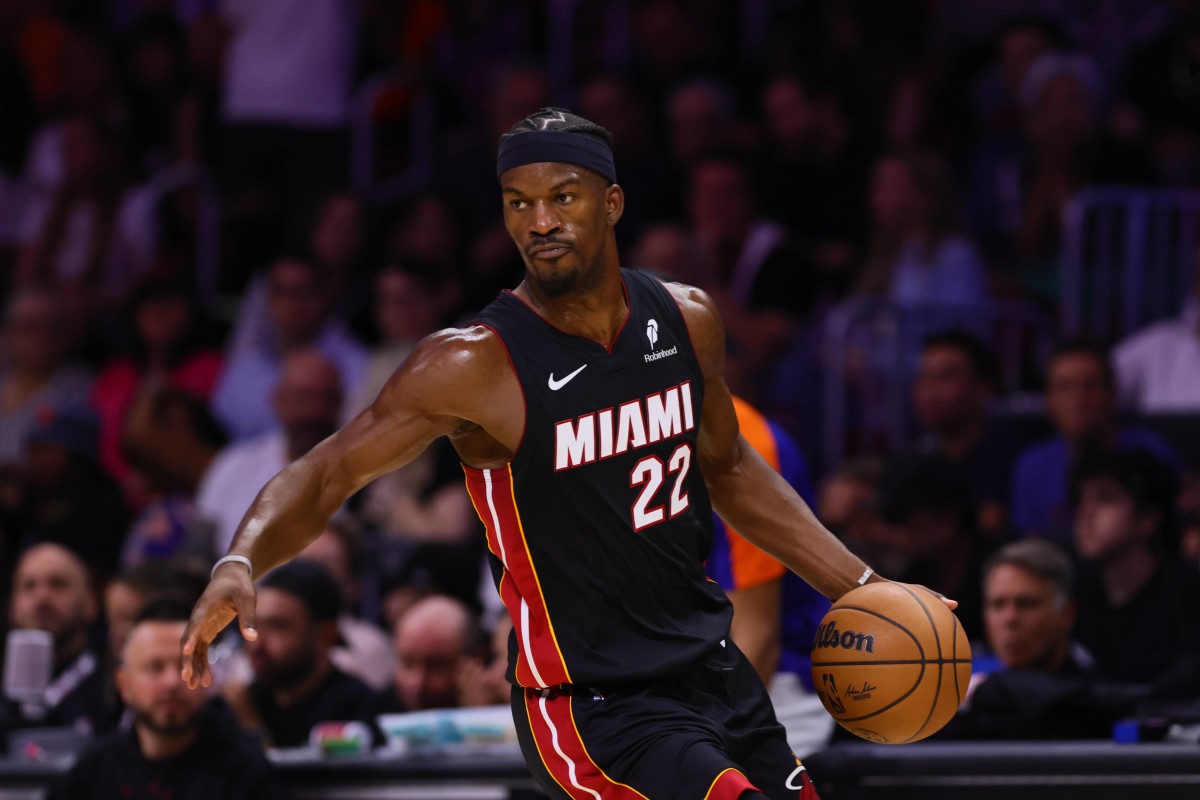 Miami Heat forward Jimmy Butler (22) dribbles the basketball against the New York Knicks during the second quarter at Kaseya Center.