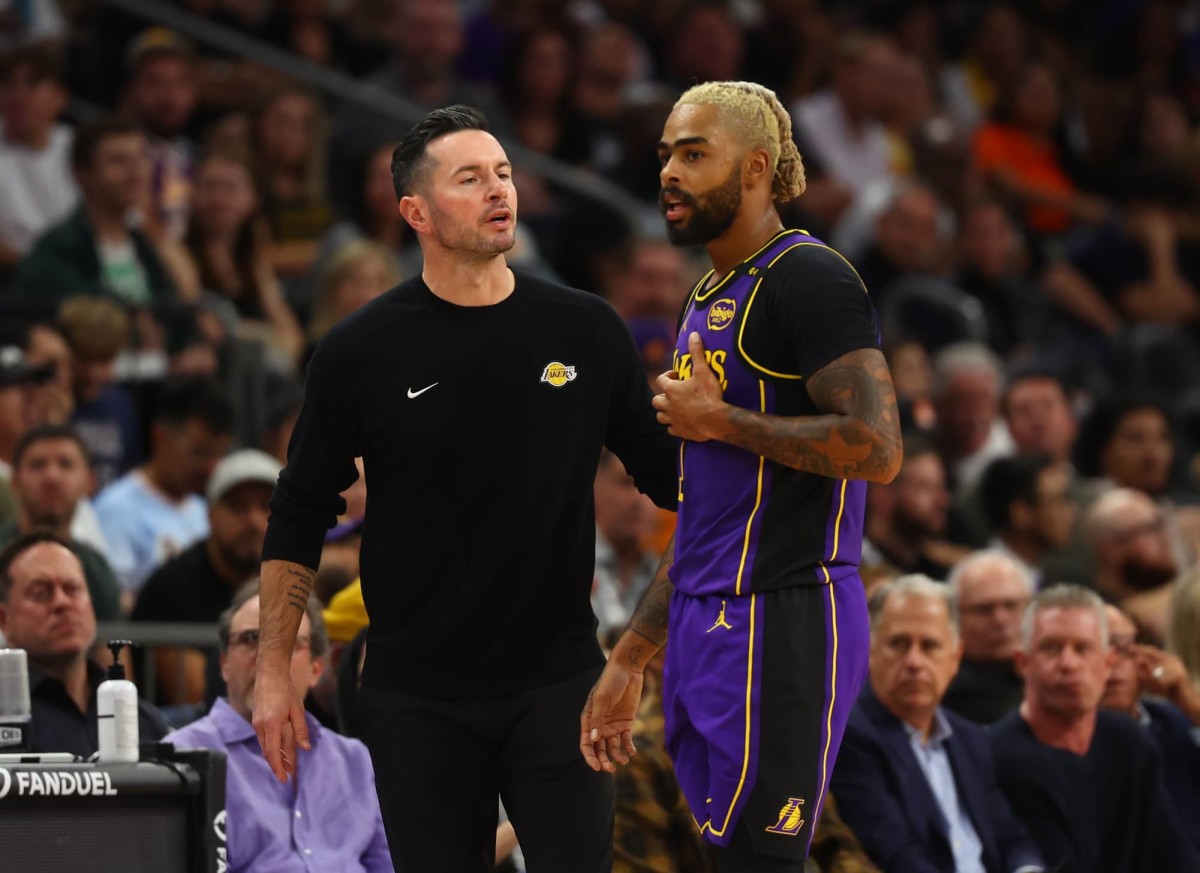 Oct 28, 2024; Phoenix, Arizona, USA; Los Angeles Lakers head coach JJ Redick with guard D'Angelo Russell (1) against the Phoenix Suns at Footprint Center.