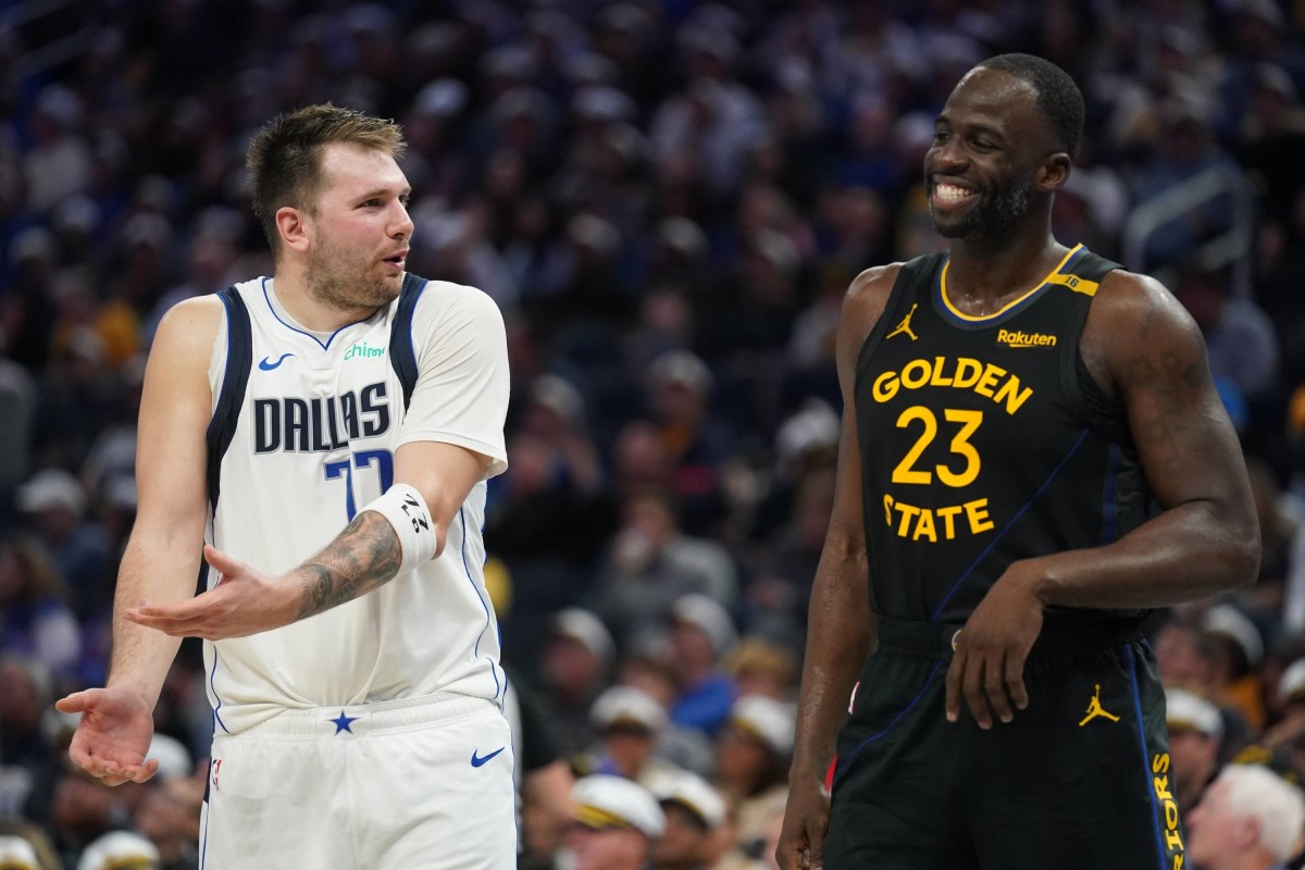 Nov 12, 2024; San Francisco, California, USA; Dallas Mavericks guard Luka Doncic (77) talks with Golden State Warriors forward Draymond Green (23) after being called for a foul in the fourth quarter at the Chase Center. Mandatory Credit: Cary Edmondson-Imagn Images  