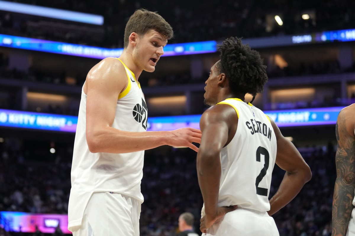 Mar 31, 2024; Sacramento, California, USA; Utah Jazz center Walker Kessler (left) talks with guard Collin Sexton (2) during halftime against the Sacramento Kings at Golden 1 Center. Mandatory Credit: Darren Yamashita-Imagn Images  