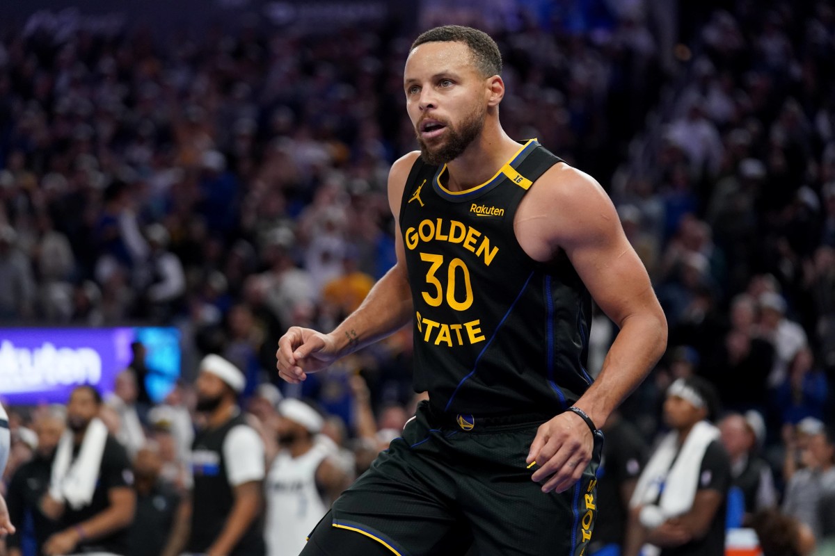 Nov 12, 2024; San Francisco, California, USA; Golden State Warriors guard Stephen Curry (30) reacts after making a layup against the Dallas Mavericks in the fourth quarter at the Chase Center. Mandatory Credit: Cary Edmondson-Imagn Images