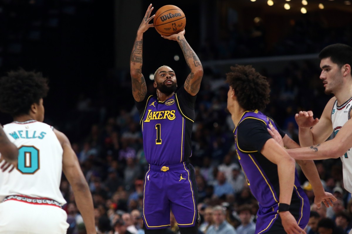 Nov 6, 2024; Memphis, Tennessee, USA; Los Angeles Lakers guard D'Angelo Russell (1) shoots for three during the first half against the Memphis Grizzlies at FedExForum. Mandatory Credit: Petre Thomas-Imagn Images