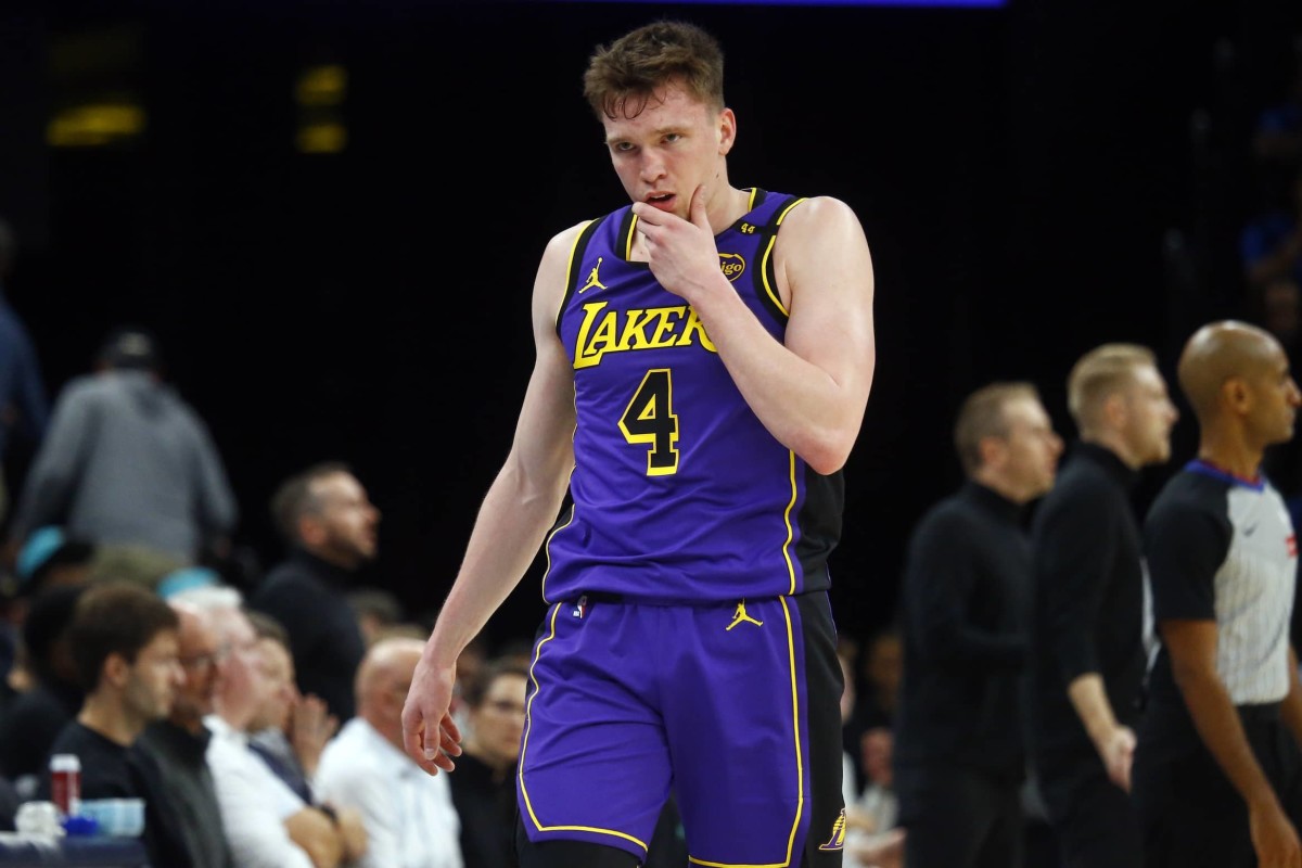 Nov 6, 2024; Memphis, Tennessee, USA; Los Angeles Lakers guard Dalton Knecht (4) checks out of the game during the second half against the Memphis Grizzlies at FedExForum.