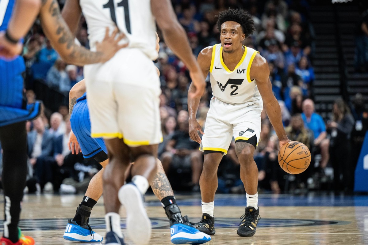 Feb 29, 2024; Orlando, Florida, USA; Utah Jazz guard Collin Sexton (2) dribbles the ball against the Orlando Magic in the fourth quarter at Kia Center. Mandatory Credit: Jeremy Reper-Imagn Images  